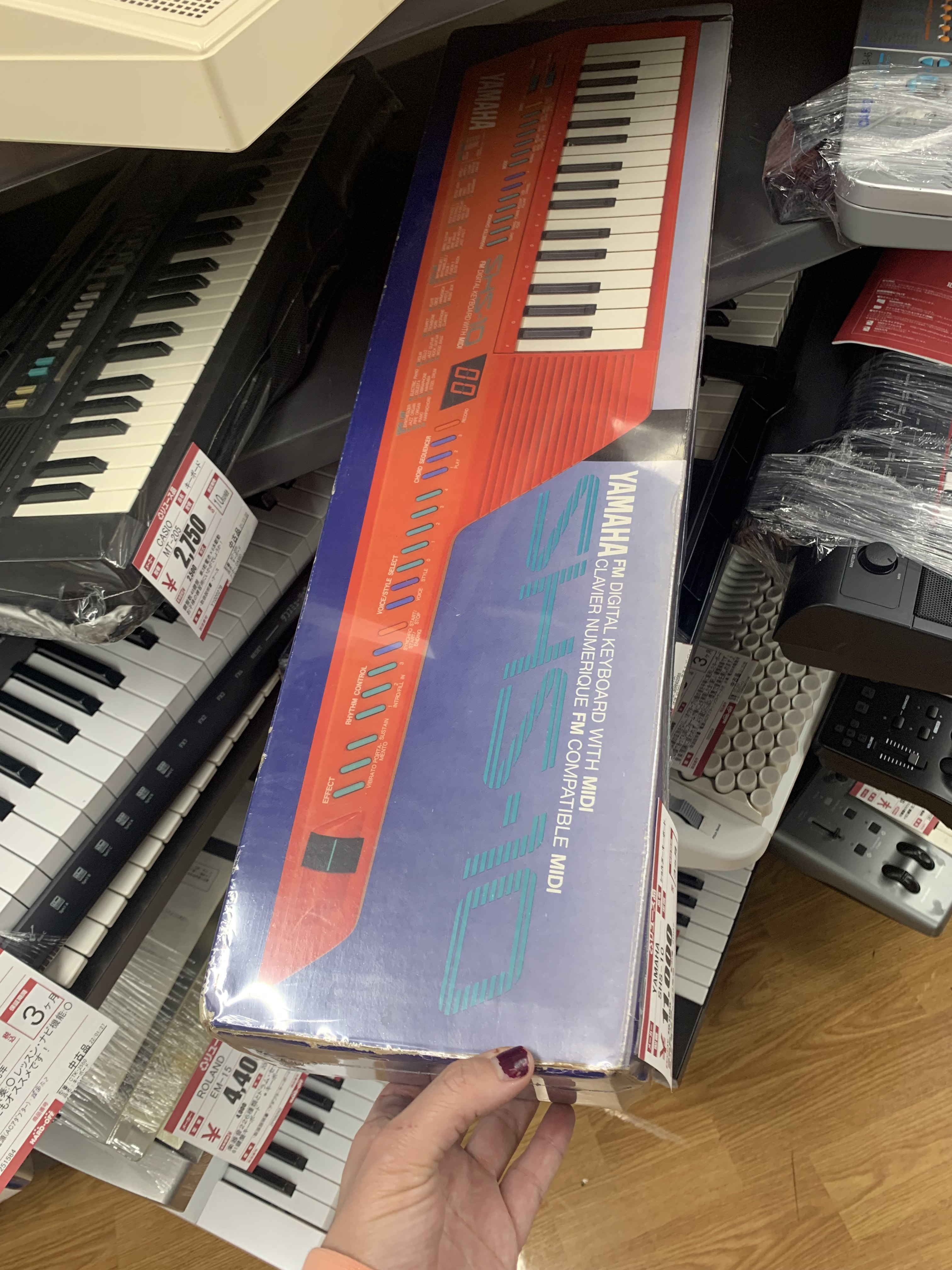 A red Key-tar in original packaging for sale at a second hand store in Tokyo. Photo by Denisse Rauda.